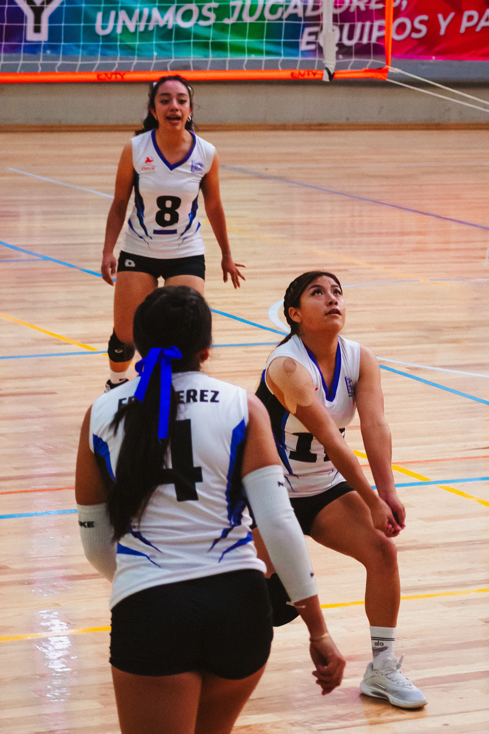 Women's indoor volleyball match action — weekly best-of set.