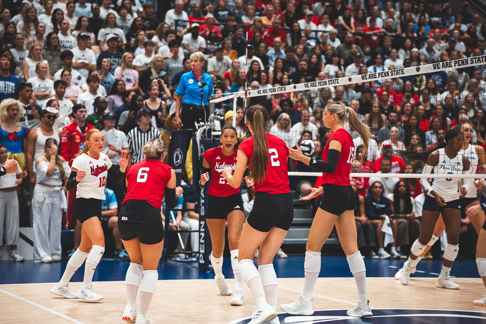 Nebraska Huskers volleyball celebrating a point at Penn State's Rec Hall, 2026.