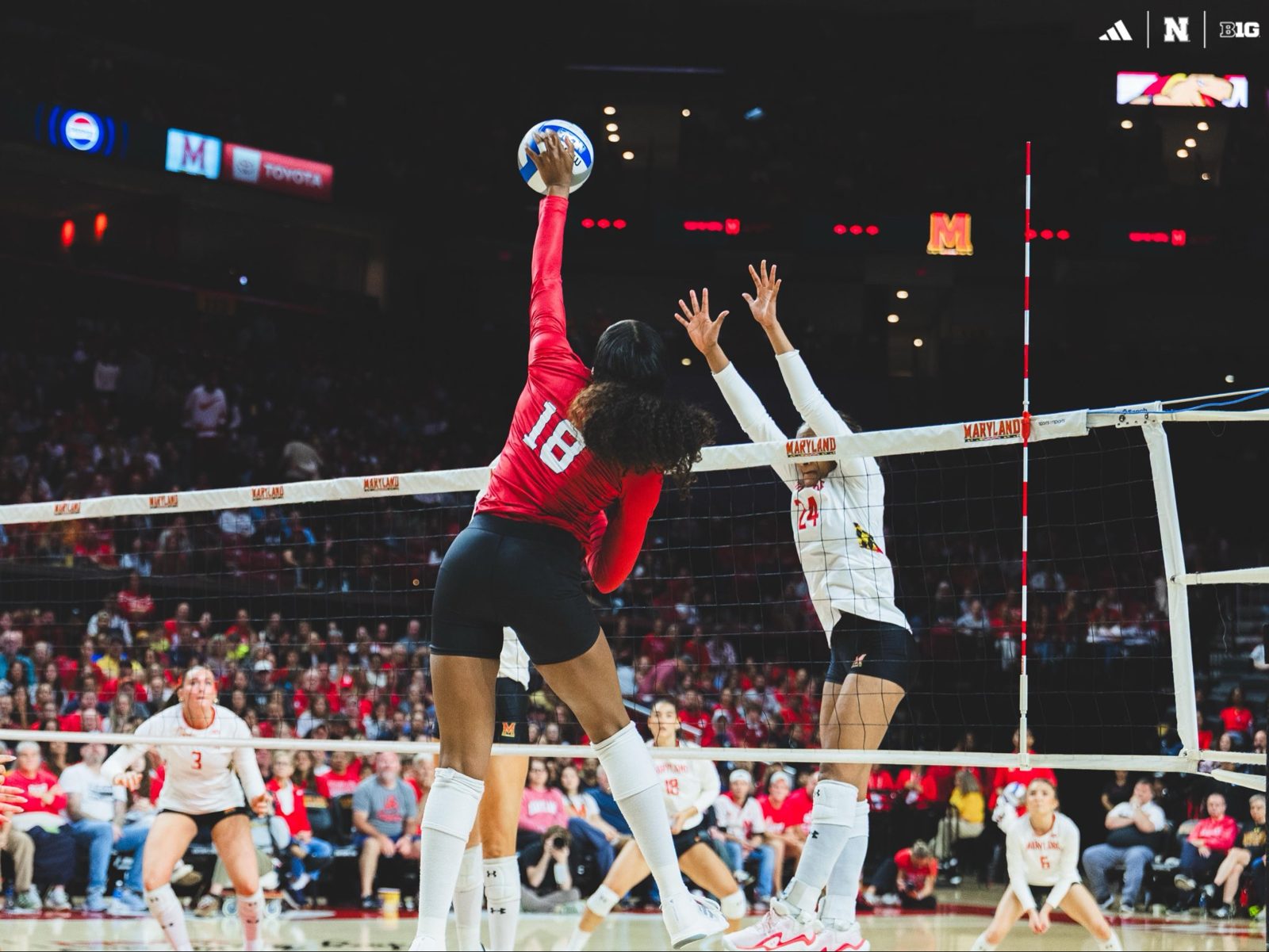 Nebraska Huskers volleyball attack at the net during the 2026 sweep at Maryland.